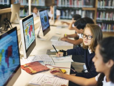 Girls Studying Map Class Concept