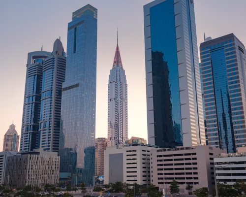 25 March 2023, Dubai, UAE: expensive luxury skyscrapers in the area Emirates Towers Metro Station, tourist trip to futuristic dubai